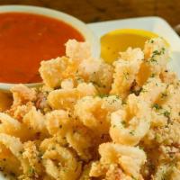 Fried Calamari · Hand-dipped and breaded, served with spicy marinara sauce.