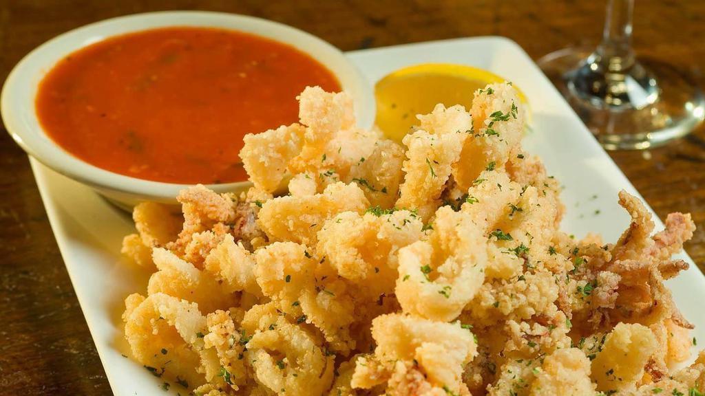 Fried Calamari · Hand-dipped and breaded, served with spicy marinara sauce.