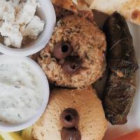 Mediterranean Platter · Baba ganouj and garlic hummus. Served with 2 stuffed grape leaves, carrots, celery, feta che...