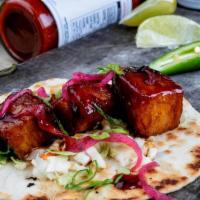Pork Belly · Sweet & spicy chile glaze, green onion, asian slaw, pickled red onions.
