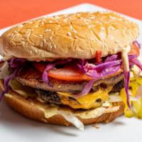 Hawaiian Burger · Juicy beef patty, Cheddar cheese, citrus coleslaw, pineapple flambé, pickles, tomatoes, onio...