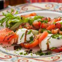 Caprese Salad · Mozzarella di bufala, tomatoes and basil