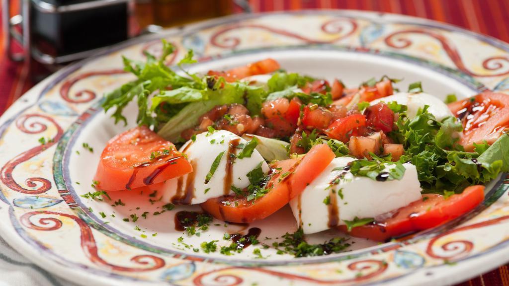 Caprese Salad · Mozzarella di bufala, tomatoes and basil