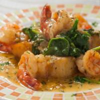 Scampi Cosanostra · Served with spinach and roasted potatoes. Sautéed shrimp with garlic, lemon and herbs