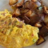 Western Omelette · Ham, red and green peppers, onions, and cheddar cheese. Served with multi-grain toast and ho...