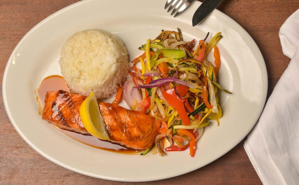 Soy Ginger Teriyaki Glazed Grilled Salmon · Accompanied by steamed jasmine rice and wok charred vegetables.