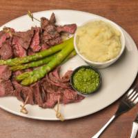 Skirt Steak · Topped with melted blue cheese accompanied by roasted garlic mashed potatoes and grilled asp...