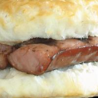 Link Sausage Biscuit  · A hot buttery biscuit with a country-styled pork link.
