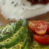 Avocado Toast · Avocado, tomato, cucumber, seasoned with lemon, salt and pepper. Topped with chia and olive ...
