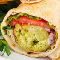 Falafel Wrap · Three chickpea patties served on pita bread, lettuce, tomatoes, pickles, tahini sauce with f...