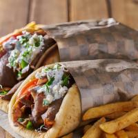 Gyro Wraps · Slow-cooked gyro With sautéed onions, green peppers, mushrooms, rice, feta cheese, and cucum...