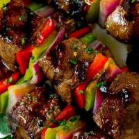 Beef Shish Kebabs · Fire-grilled kebabs served with basmati rice, hummus, house salad or fries. Additional charg...