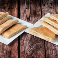 Tostada Large · Loaf of Cuban bread with butter/ Libra de pan cuban con mantequilla