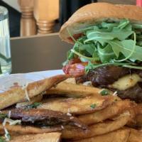 Butcher'S Smoked Bacon Burger · Gouda cheese, caramelized onions, arugula, charred tomatoes, house pickles and bourbon-red p...