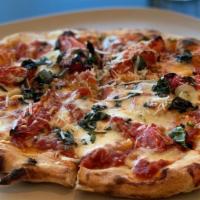 Tomato Basil Pizza · Vegetarian, nut_free. Mozzarella, fresh garlic and parmesan.