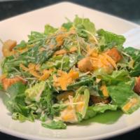 Piedmont Romaine-Kale Caesar Salad · Shaved aged Cheddar, cornbread croutons and Jalapeno-Caesar dressing.