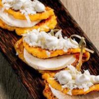 Las Cachapas · Trio of Venezuelan style sweet corn pancakes filled with queso e' mano and topped with nata ...