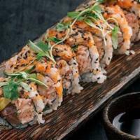 Crudo Roll · Tuna, salmon, crab salad, cilantro, avocado, topped with yuzu emulsion and masago.

Consumin...