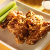 Garlic Wings · Juicy crispy wings with garlic sauce.