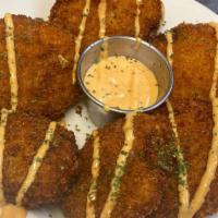 Fried Green Tomatoes · Hand breaded tomatoes served with our Juke Sauce.