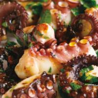 Grilled Marinated Octopus · Grilled octopus with Greek seasoning and lemon twist.