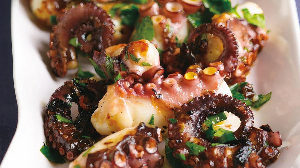 Grilled Marinated Octopus · Grilled octopus with Greek seasoning and lemon twist.