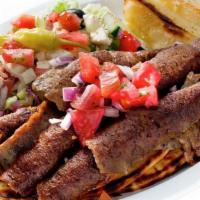 Gyro Platter · A blend of sliced beef and lamb. Served with Greek salad, pita, and Greek potatoes or french...