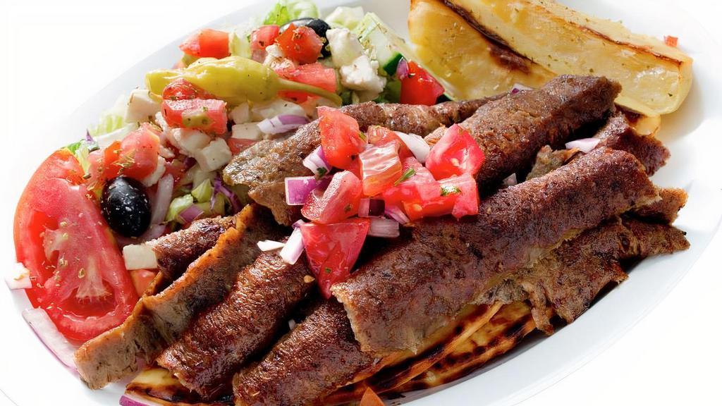 Gyro Platter · A blend of sliced beef and lamb. Served with Greek salad, pita, and Greek potatoes or french fries.