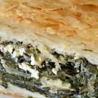 Spanakopita · Spinach pie. Served with Greek salad, pita, and Greek potatoes or french fries.