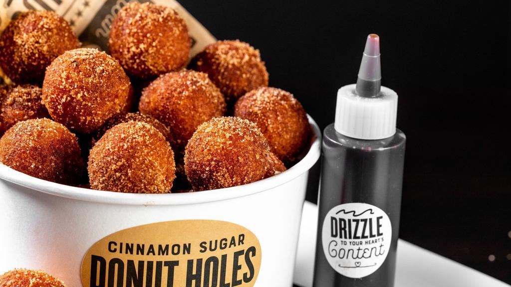Donut Holes (1810 Cals) · 24 warm, cinnamon sugar donut holes served with chocolate sauce.