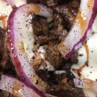 Lamb Shawarma · Rice, pickles, tomatoes, onions, garlic sauce, pita bread, hummus & baba ganoush.