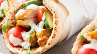 Chicken Shawarma · Pickles, tomatoes, onions, garlic sauce, pita bread, hummus & baba ganoush.