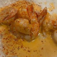 Shrimp & Grits · Southern style grits topped with grilled shrimp.