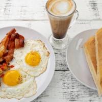 Abuela'S Favorite · Two eggs, with bacon, mini seasoned potatoes, buttery Cuban toast and café latte. 

Consumin...