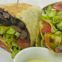 Vany'S Stake Wrap · Stake, lettuce, tomato- garlic sauce, rolled to perfection in a tortilla.
