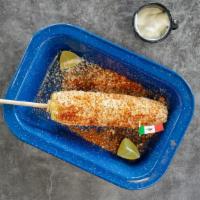 Mexican Street Corn · Mexican Corn in the Cob topped with mayo , cotija cheese , and Chili powder.