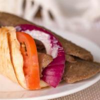 Gyro Wrap · Grilled Pita w/ Gyro Meat, Onions, Tomatoes and Nick's Grecian Sauce