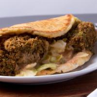 Falafel Wrap · Grilled Pita w/ Fried Falafel Nuggets, Lettuce, Tomatoes and Nick's Grecian Sauce