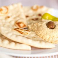Hummus & Pita · Smooth hummus spread with grilled pita, olive, and pepperoncini