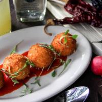 Goat Cheese Fritters · Red pepper jelly.