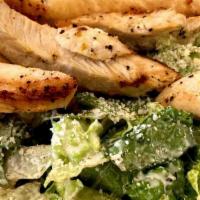 Caesar Salad · Romaine lettuce tossed with Caesar dressing, Parmesan cheese, and croutons.