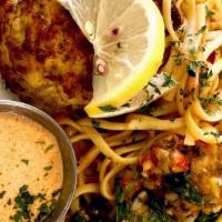 Maryland Crab Cake · One 5 oz. crab cake with Mediterranean pasta, tossed salad and rolls.
