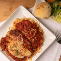 Chicken Parmesan · Lightly breaded and topped with marinara sauce and mozzarella cheese. Served with pasta.