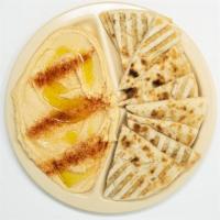 Hummus & Pita · Chickpeas, tahini, lemon, and garlic paste drizzled with olive oil and sprinkled with paprika.