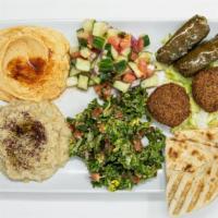 Mezze Platter · Hummus, Baba ganoush, falafel, tabouleh, Lebanese salad, and dolmas. Served with pita and sa...