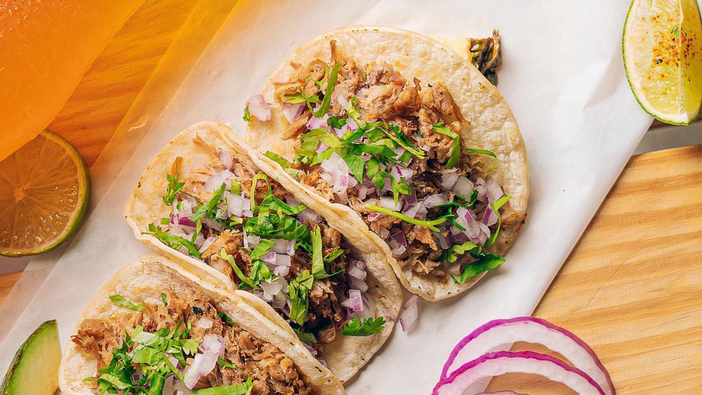 Carnitas (3 Tacos) · Slow cooked pork, onion, cilantro.