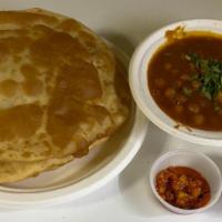 Chole Bhature · 2 Pcs. Fried Fluffy All Purpose Flour Bread served with Chole, Onion & Pickle