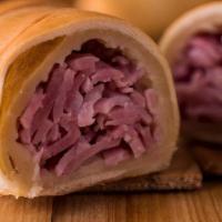 Cachito De Pavo (Sold Out) · Thin sliced smoked turkey breast rolled inside crusty-soft bread baked to perfection.