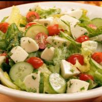 Fresh Mozzarella · Baby greens, tomatoes, fresh mozzarella cheese, basil, olive oil, lettuce, tomatoes and red ...