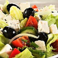 Greek Salad · Tomatoes, red onions, black olives and feta cheese with greens.
